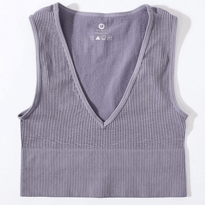 Women's ribbed seamless tank top in lavender with deep V-neck, perfect for yoga and running. Breathable, stretchy, form-fitting design.